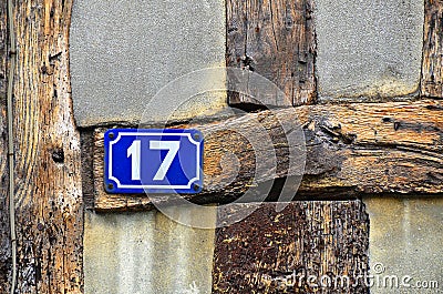 House number 17 on antique rustic wall, old, rusty enamel sign Stock Photo