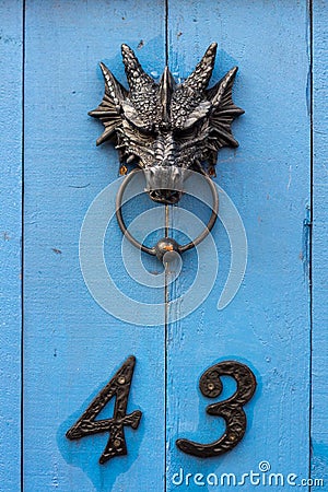 House number 43 with a dragon head door knocker Stock Photo
