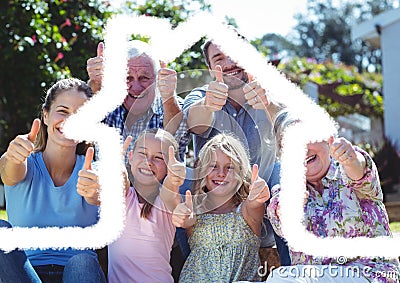 House outline over a happy multigenerational family giving thumbs up, family and housing concepts Stock Photo