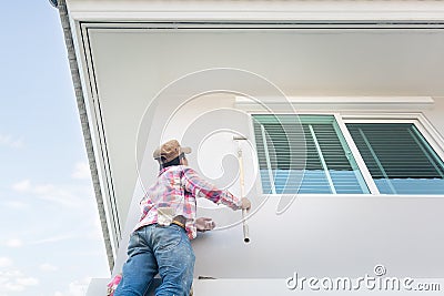 House painting work by professional, contractor. Editorial Stock Photo