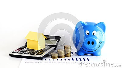 House paper on Calculator and coins and piggy bank for home Loan Stock Photo