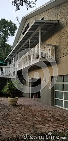 House papers driveway garage doors balcony Stock Photo