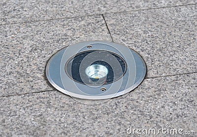 House path lighting installed in stone pavement. Stock Photo