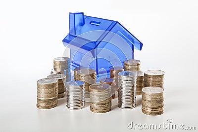 House piggy bank and coin Stock Photo