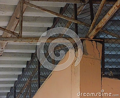 The house pillars that bear the weight of the large roof structure are broken. Stock Photo