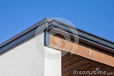 House rain grey gutter waterproofing home corner roof facade Stock Photo