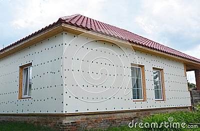 House renovation wall insulation with styrofoam. Unfinished hou Stock Photo