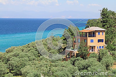 House by the sea , in olive groove Stock Photo