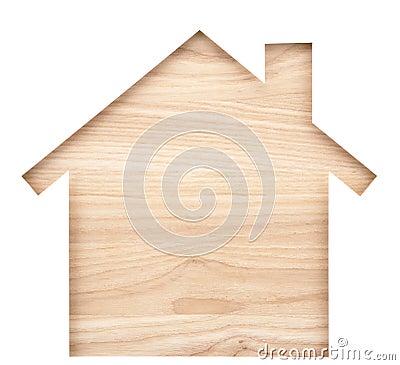 House shaped paper cutout on natural wood lumber. Stock Photo