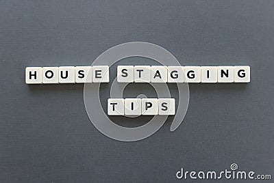 House staging tips word made of square letter word on grey background. Stock Photo