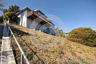 House on a steep hill with stilts Stock Photo