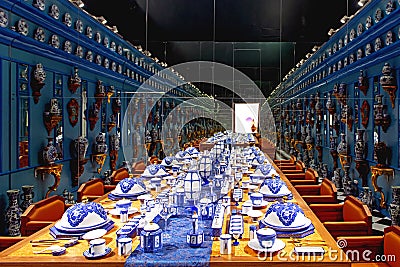 House with Table and wall fill of china porcelain Stock Photo