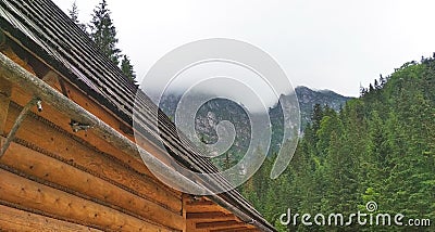 A house for tourists on the background of the foggy Tatra Mountains. Stock Photo
