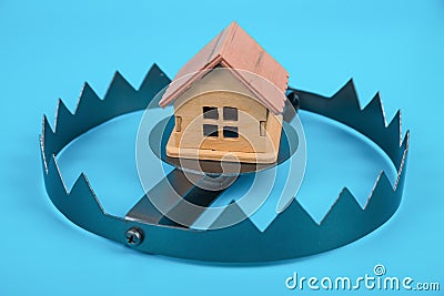A house in trap. Concept risk in real estate. Stock Photo