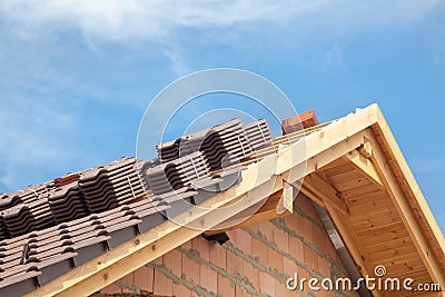 House under construction. Roofing tiles preparing to Install. Stock Photo