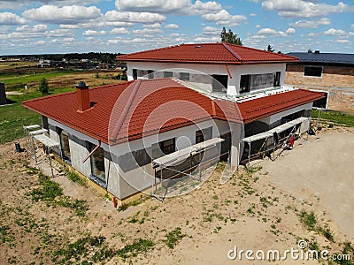 House under construction with scaffolds Stock Photo