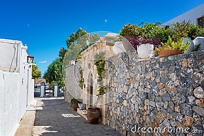 House/villa with flowers on the way to Acropolis of Lindos Rhod Stock Photo