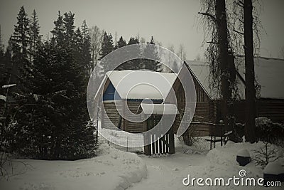House in village in winter. Farming in forest in snow. Roof in snow. Small house Stock Photo
