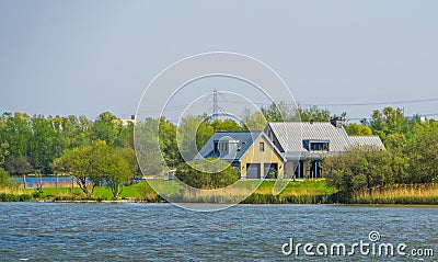 House at the water, Cottage at the seaside of tholen, Bergse diepsluis, Oesterdam, Zeeland, The netherlands Stock Photo