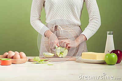 House wife wearing apron making. Steps of making cooking apple c Stock Photo