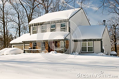 House after winter snowstorm Stock Photo