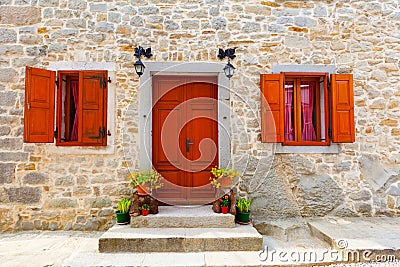 House with wooden windows and door, Stock Photo