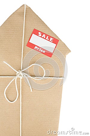 House Wrapped In Brown Paper With Sale Sticker Stock Photo