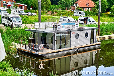 Houseboat for rent in the harbor for use as a vacation home waiting for vacationers Editorial Stock Photo