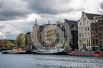 Houseboats and Dutch architecture in Amsterdam Editorial Stock Photo