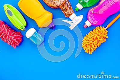 Housecleaner tools set with detergents, soap, cleaners and brush on blue background top view mock up Stock Photo