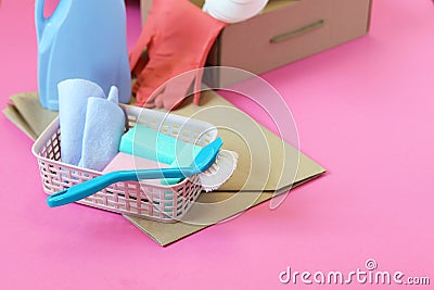 Household cleaning products in open boxes on a bright background Stock Photo