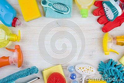 Household cleaning products on wooden background with copyspace in middle Stock Photo