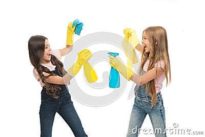 Household duties. Little helper. Girls cute kids cleaning around with mist sprayer. Keep it clean. Sisters rivalry. Who Stock Photo