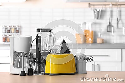 Household and kitchen appliances on table Stock Photo