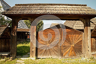 Household. Traditionally carved gate from Breb village, MaramureÈ™ County, Romania. Stock Photo