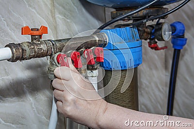 Household water supply unit, valves blocking access to pipes. Stock Photo