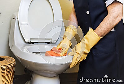 Housekeeper cleaning a hotel room Stock Photo