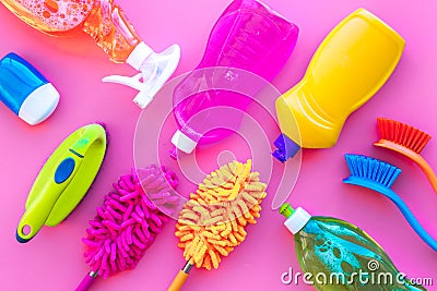 Housekeeping tool. Detergents, soap, cleaners and brush for housecleaner work on pink background top view space for text Stock Photo