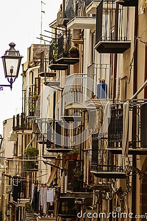 Houses along the shoreline and cathedral in background, Cefalu, Stock Photo