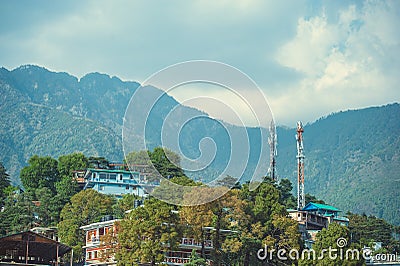 Houses on background blue sky with clouds and himalayan mountains Stock Photo