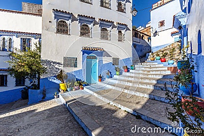 Houses in the blue town Chefchaouen with colourful flower pots Stock Photo