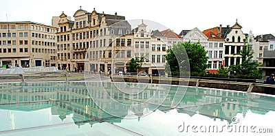 Houses stand in a row and are reflected in the glass Stock Photo