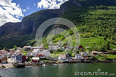 Houses by the coast of the lake in the Narrow Fjord in the Flam village in Norway Stock Photo