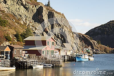 Houses with fishing boats in historic Quidi Vidi Village, St. J Editorial Stock Photo