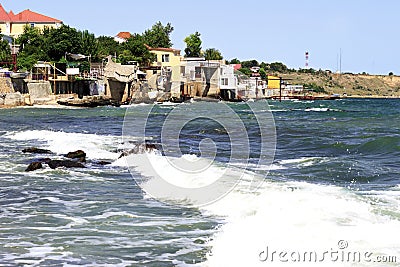 Houses hanging over the sea. Sea Village. Stock Photo