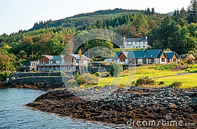 Houses by Loch Linnhe in Corran, a village situated on the Corran Narrows of Loch Linnhe, in Scotland. Stock Photo