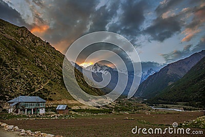 Houses in a mountain village with a sunrise background Stock Photo