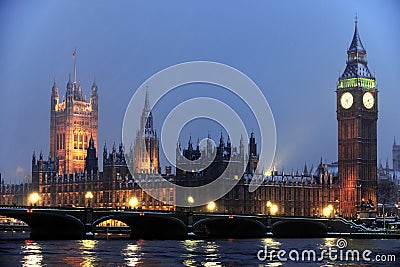 Houses of Parliament in the snow at nightfall Stock Photo