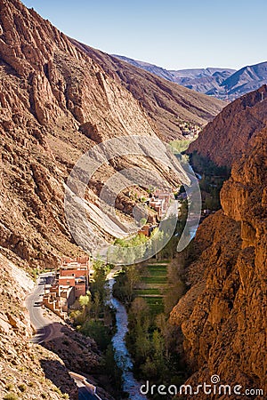 Houses, River and Road R704 at Gorges du Dades in Morocco Stock Photo