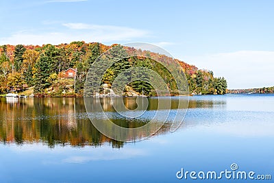 Houses on the shores of a lake a clear autumn day Stock Photo